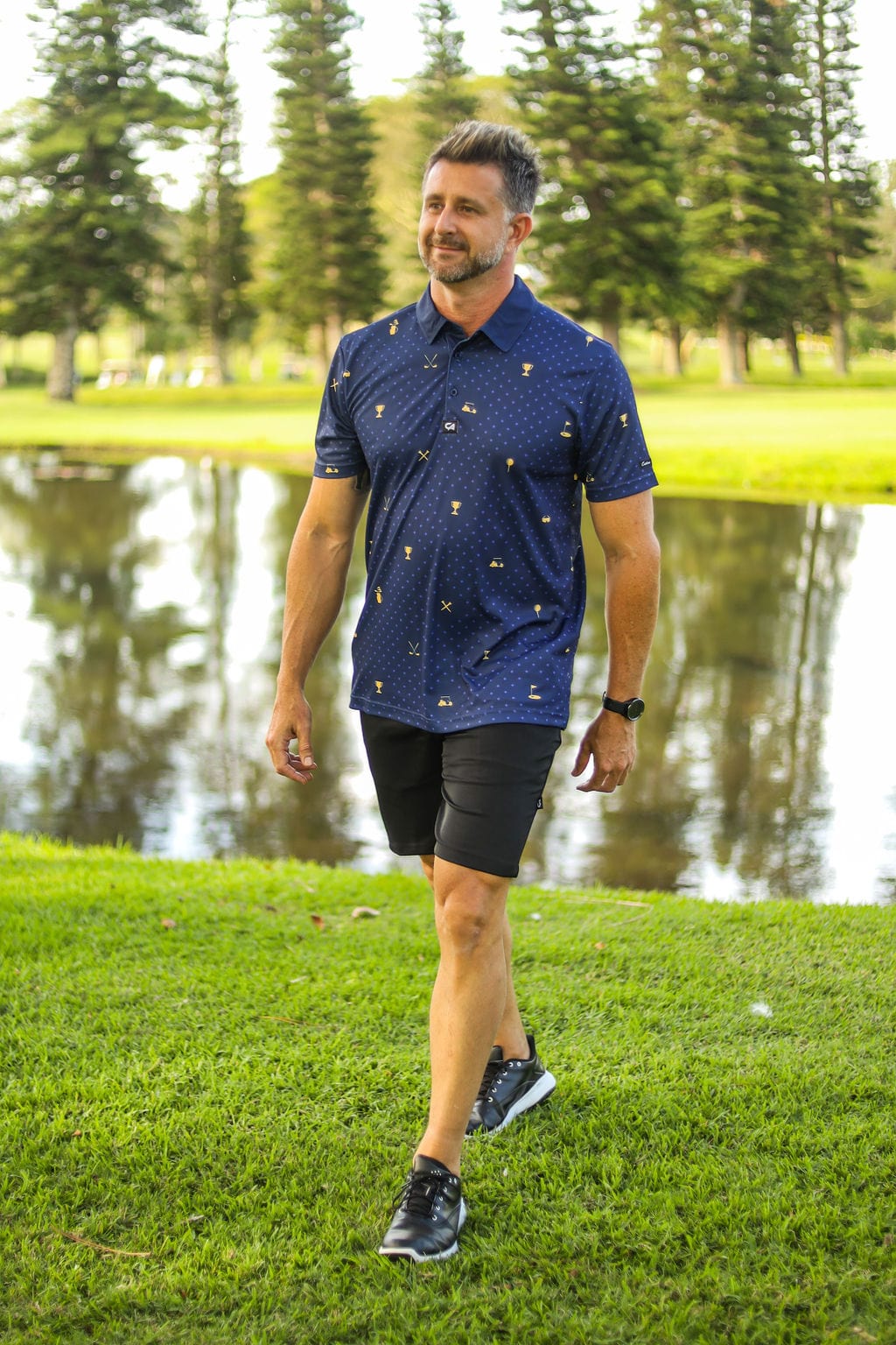 CA Statement Golf Shirt | Navy & Gold